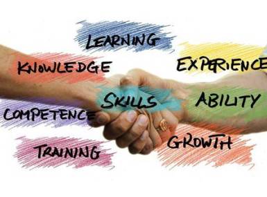 Hand shaking hand with words of encouragement around