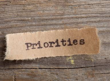 Priorities in typewriter font on a small slip of paper