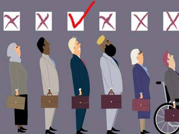 People of all types lined up with boxes above them. Only the male white man has a check mark.