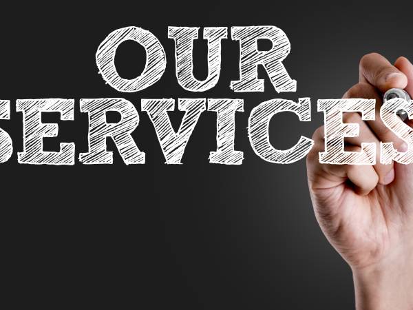 Hand writing our services with chalk