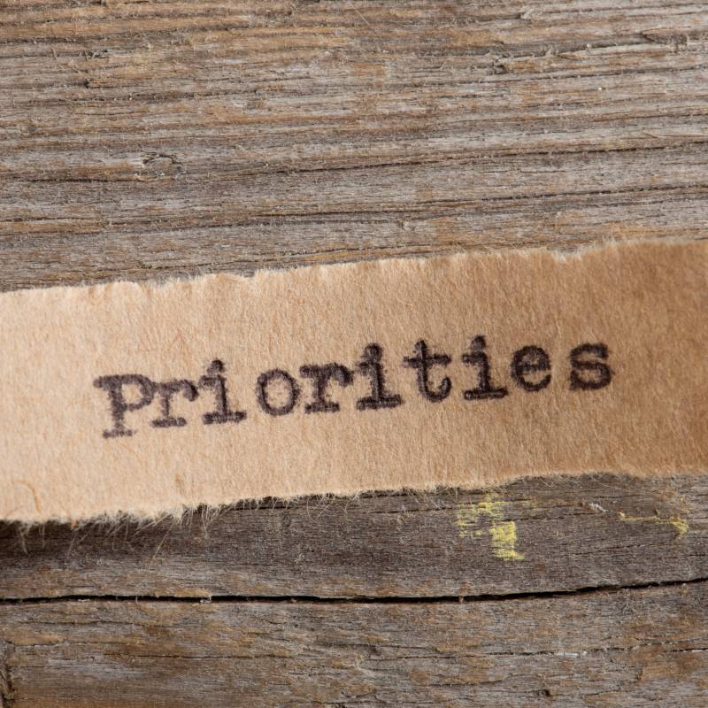 Priorities in typewriter font on a small slip of paper