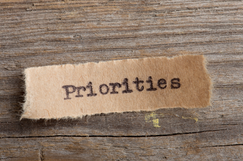 Priorities in typewriter font on a small slip of paper